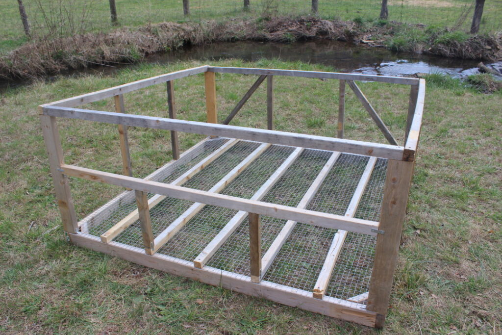 Adding a back wall to a mobile chicken coop.