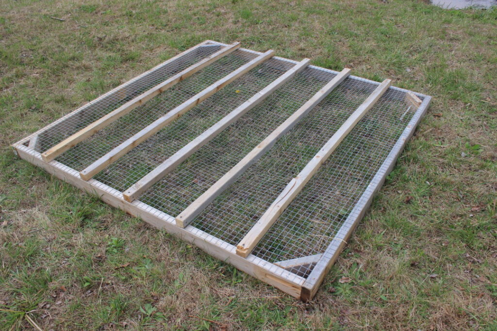 Adding perches to a mobile chicken coop.