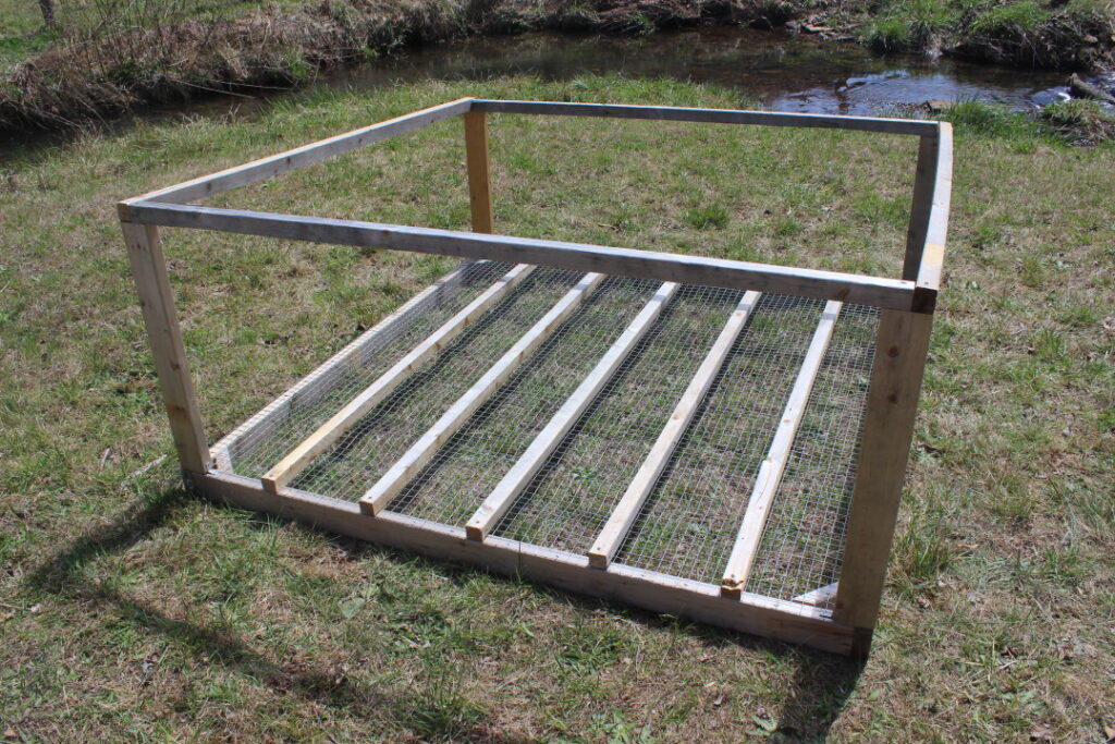 Adding a top frame to a mobile chicken coop.
